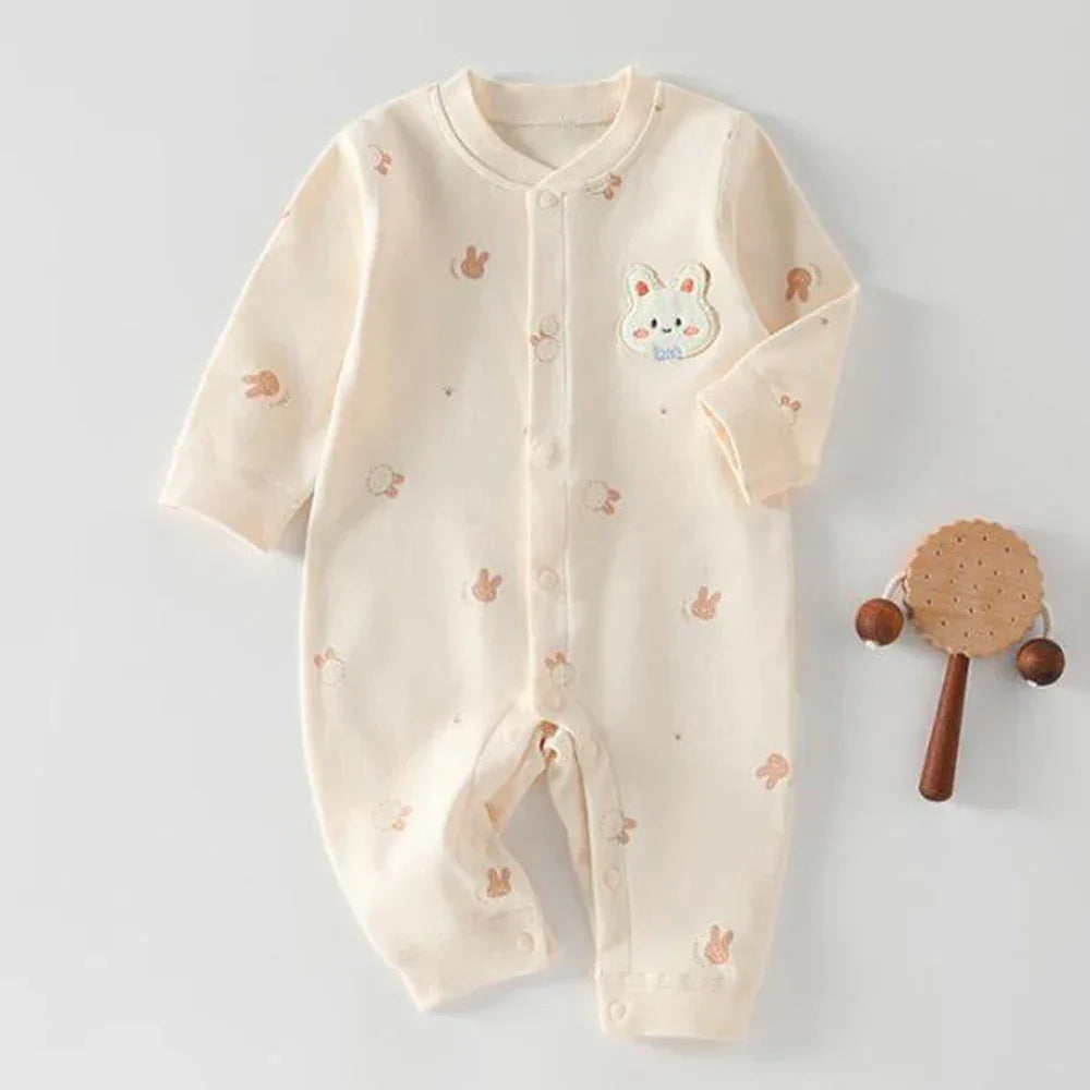Cream long sleeve ultra soft baby romper with small brown animal prints and a bunny patch for newborns