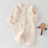 Cream long sleeve ultra soft baby romper with small brown animal prints and a bunny patch for newborns