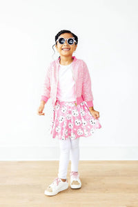 Girls pink unicorn kitty leggings skirt for girls with white leggings, white shirt, and pink cardigan