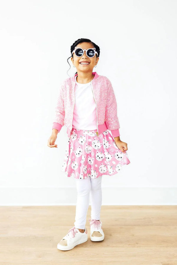Girls pink unicorn kitty leggings skirt for girls with white leggings, white shirt, and pink cardigan