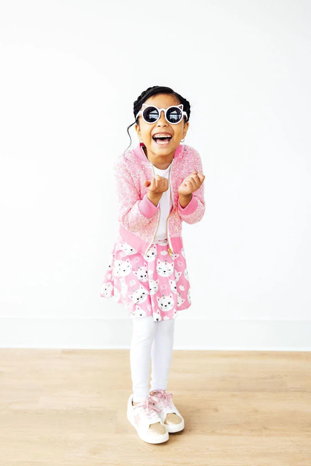 Girls white skegging with pink unicorn kitty leggings skirt for girls, paired with pink jacket and sunglasses