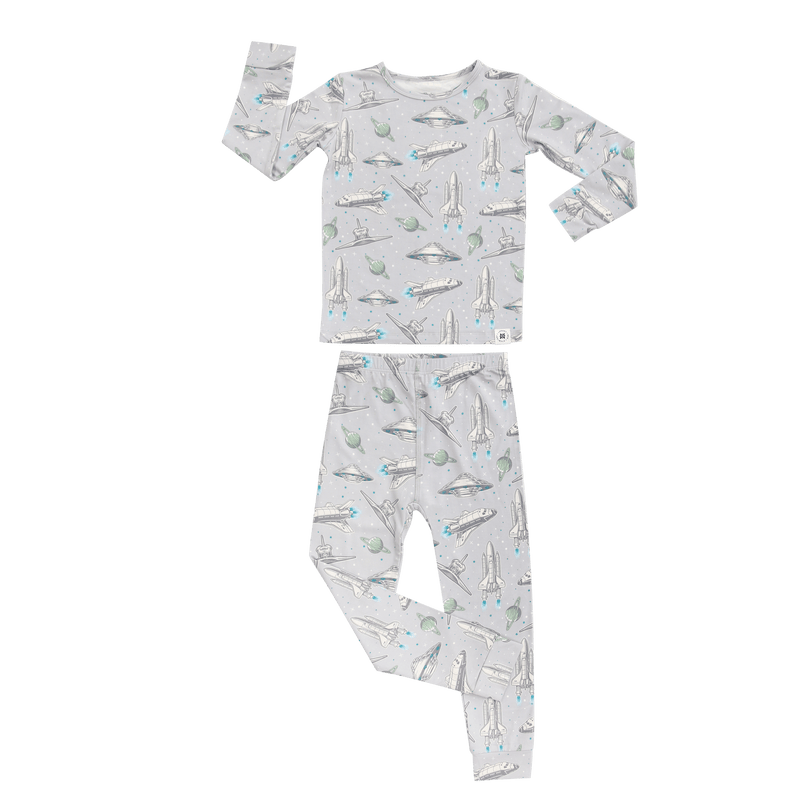Up and Away Big Kid Pajama set with space rocket print on gray fabric.