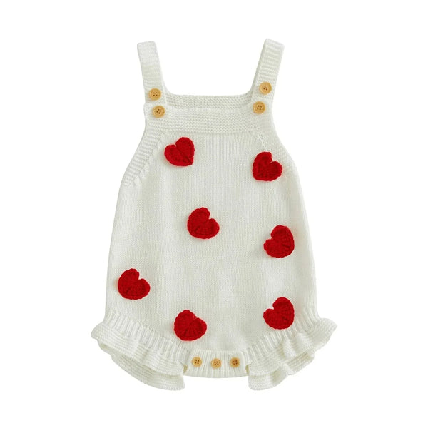 White knitted Valentine's Day baby romper with red heart accents and wooden buttons