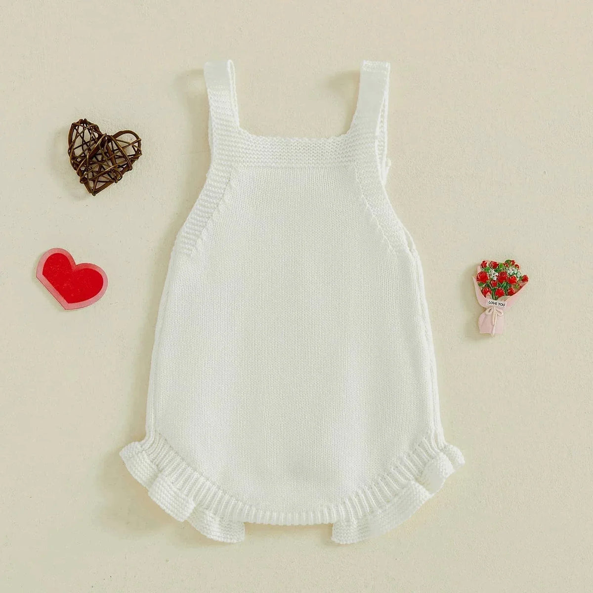 White knitted cotton Valentine's Day baby romper with ruffle trim and sleeveless design