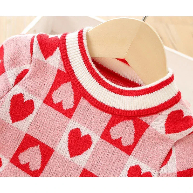 Pink and red knitted Valentine's Day dress for little girls with heart pattern and ribbed collar