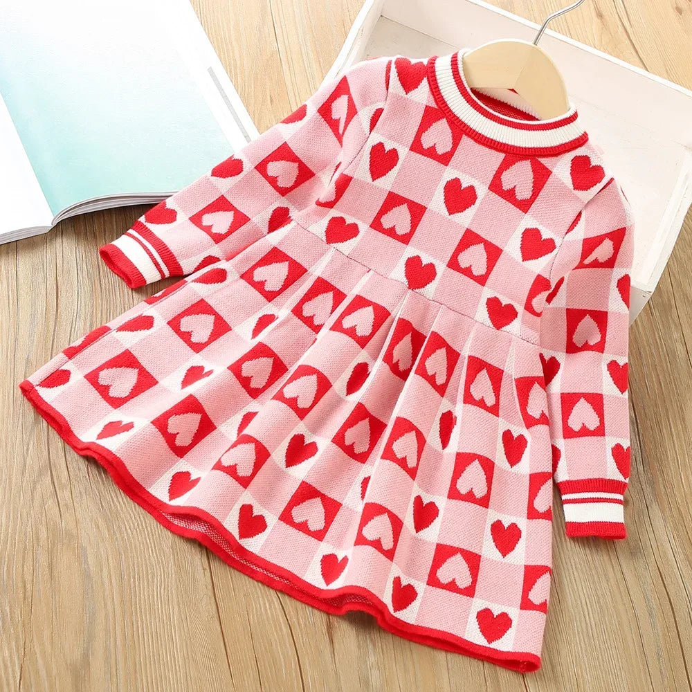 Pink and red knitted Valentine's Day dress for little girls with heart pattern and long sleeves