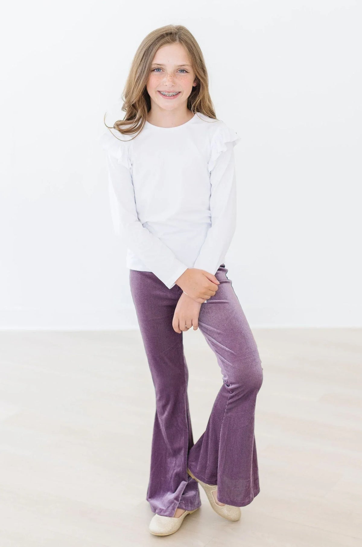 Girls purple velvet bells pants by Mila & Rose with a flared leg style