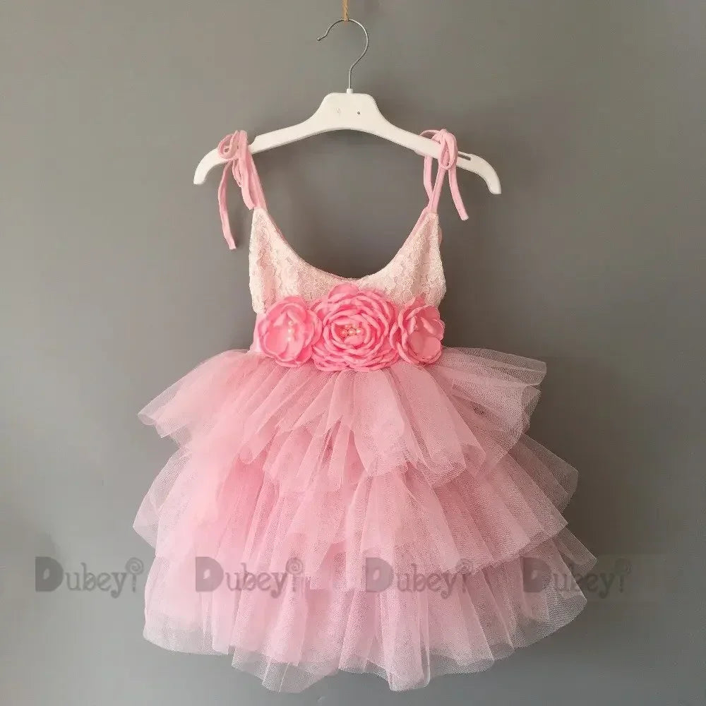 Pink vintage girl dress with layered tulle skirt and floral waist detail, for infants