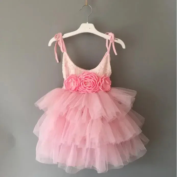 pink vintage baby girl dress with tiered tulle skirt and floral waist detail for infants