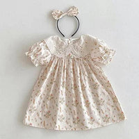 Cream floral cotton vintage baby girl outfit with embroidered collar and matching bow headband