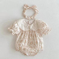 Pink cotton vintage baby girl outfit with floral print and eyelet lace collar, includes matching scrunchie