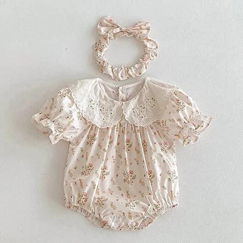 Pink cotton vintage baby girl outfit with floral print and eyelet lace collar, includes matching scrunchie