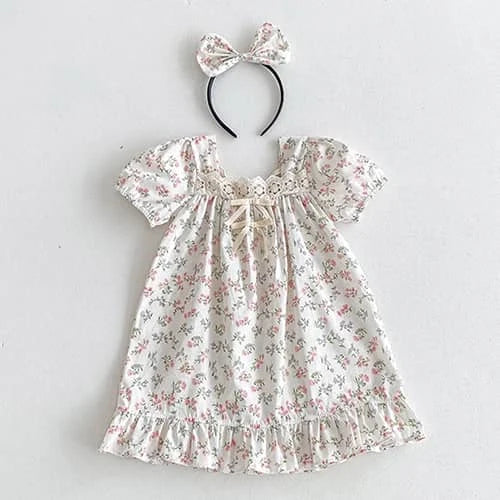 Floral vintage baby girl outfits dress with puff sleeves and matching bow headband in soft pastel colors