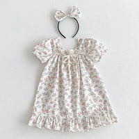 Floral vintage baby girl outfits dress with puff sleeves and matching bow headband in soft pastel colors