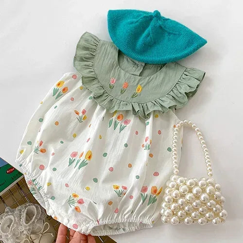 baby romper with green ruffled collar and vintage floral baby romper pattern in pastel colors