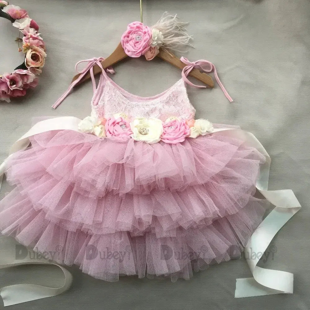 Pink vintage girl dress with tiered tulle skirt and floral waist detail for infants