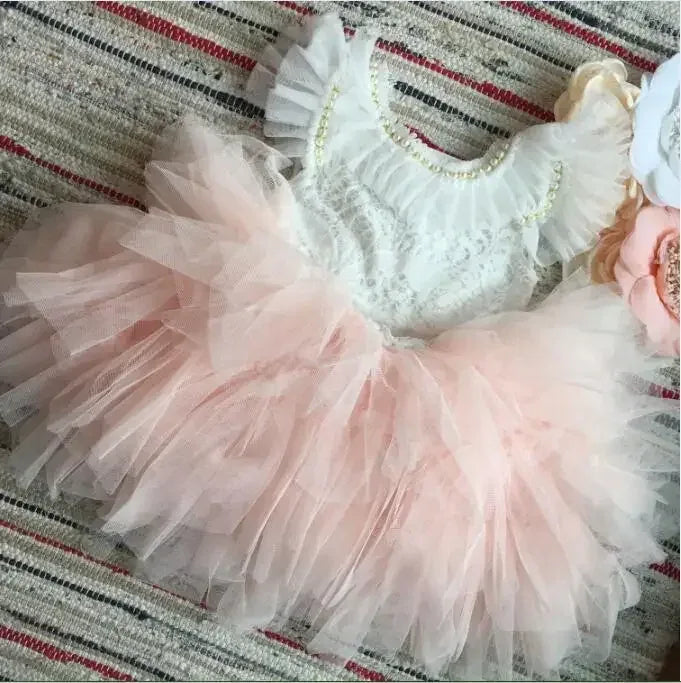 pink and white vintage girl dress with tulle skirt and pearl accents for infants