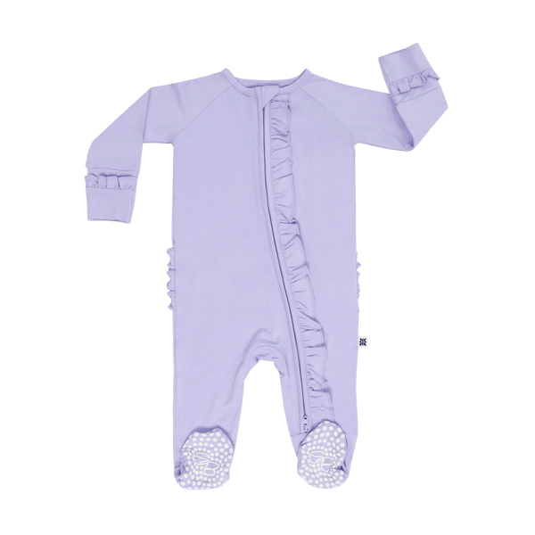 Violets Are Violet Ruffle Footie in lavender with two-way zipper, ruffles, and polka-dot soles.