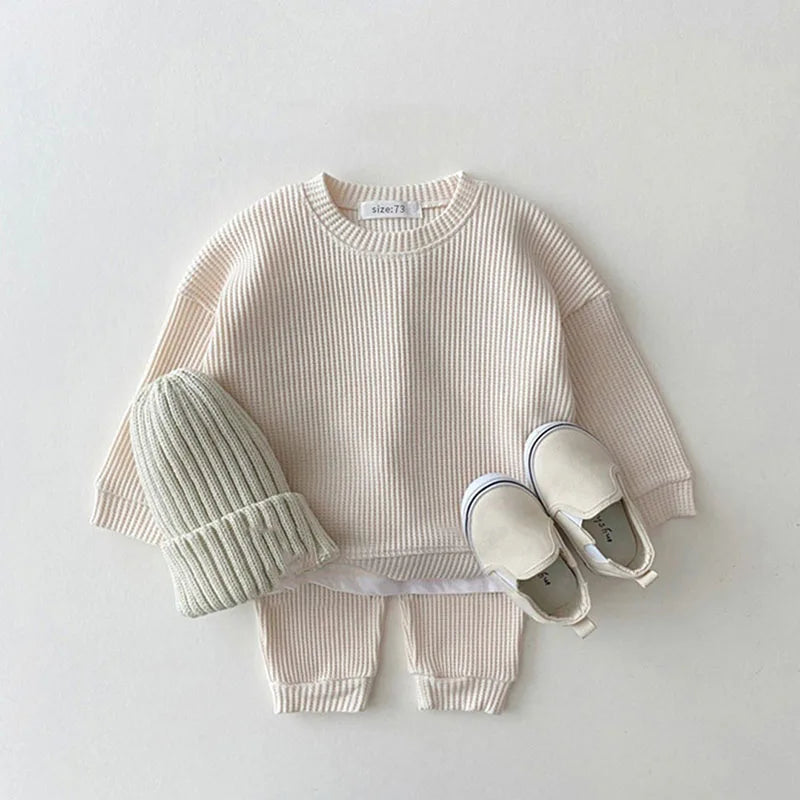 cream waffle cotton baby knit set size 73 with matching knit hat and beige slip-on shoes
