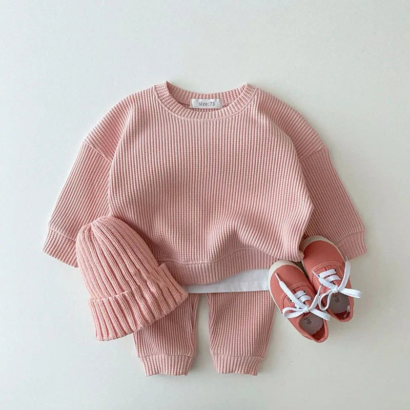 Pink waffle cotton baby knit set with long sleeve top, pants, and matching hat size 73
