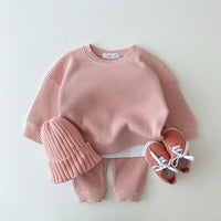 Pink waffle cotton baby knit set with long sleeve top, pants, and matching hat size 73