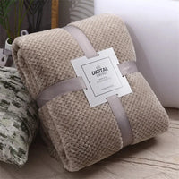 Beige waffle cut baby blanket swaddle for infants with soft textured fabric and cozy warmth