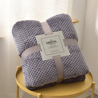 Gray waffle cut baby blanket swaddle for newborns folded neatly with packaging and soft texture