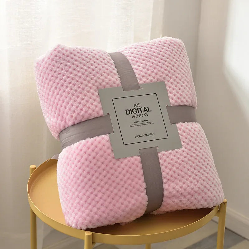 Pink waffle cut baby blanket swaddle for newborns with soft textured fabric and gray ribbon