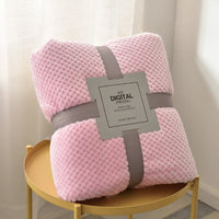 Pink waffle cut baby blanket swaddle for newborns with soft textured fabric and gray ribbon