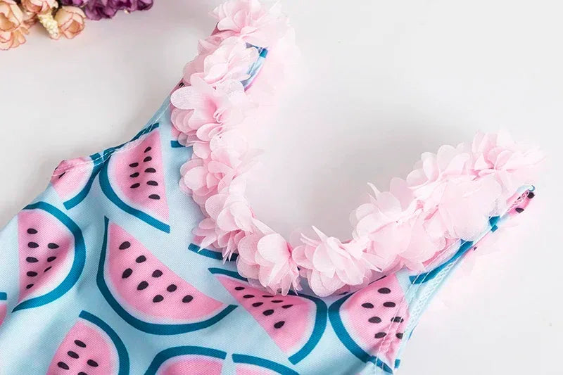 Blue and pink watermelon baby swimsuit with pink floral ruffle straps for infants