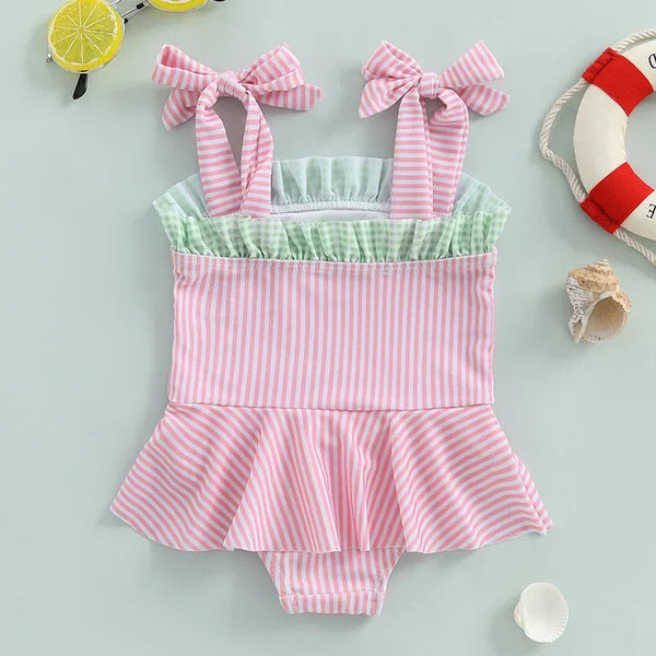 Pink and green striped cotton watermelon baby swimsuit with bow straps and ruffle skirt