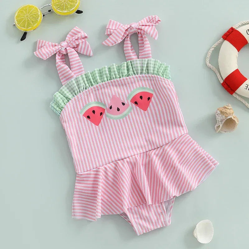 Pink and green striped watermelon baby swimsuit made of soft cotton with ruffle and bow straps