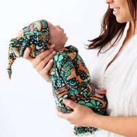 SoftKnot Cap in Wild West print on newborn, bamboo fabric for comfy, non-scratch headwear.