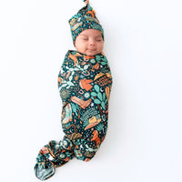 Newborn wearing The SoftKnot Cap Wild West, a bamboo, cozy, non-scratch headwrap with a knotted top.