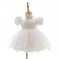 white baby girl tulle dress with puff sleeves for infants and toddlers