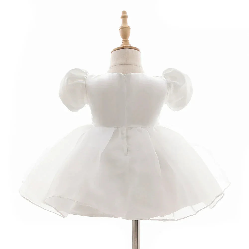 white baby girl tulle dress with puff sleeves for infants and toddlers