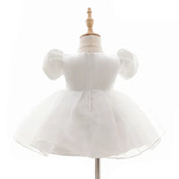 white baby girl tulle dress with puff sleeves for infants and toddlers