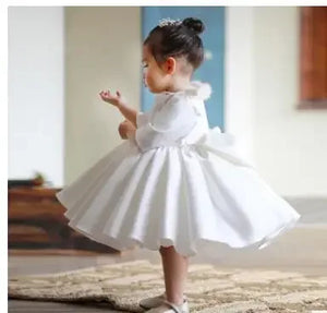 White special occasion dress for toddler girls with full skirt and bow detail