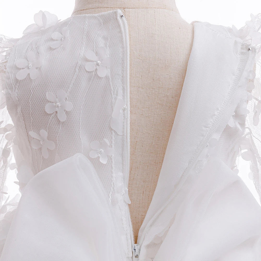 close-up of white flower girl dress with headband showing back zipper and delicate floral lace details
