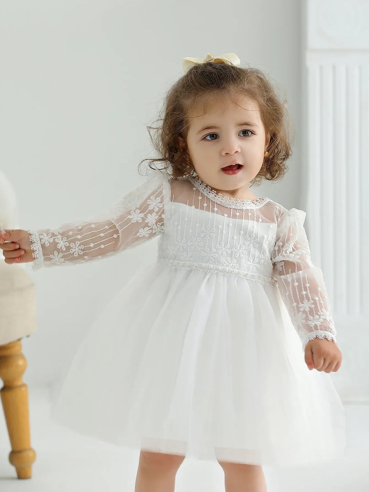 White lace occasion dress for little girls, toddler size with sheer long sleeves and floral embroidery