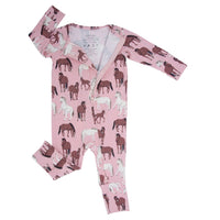 Baby romper with horse pattern on a pink background