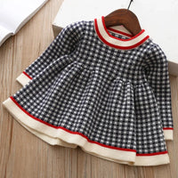 Girls black and white checkered winter knit dress for little girls with red and cream trim