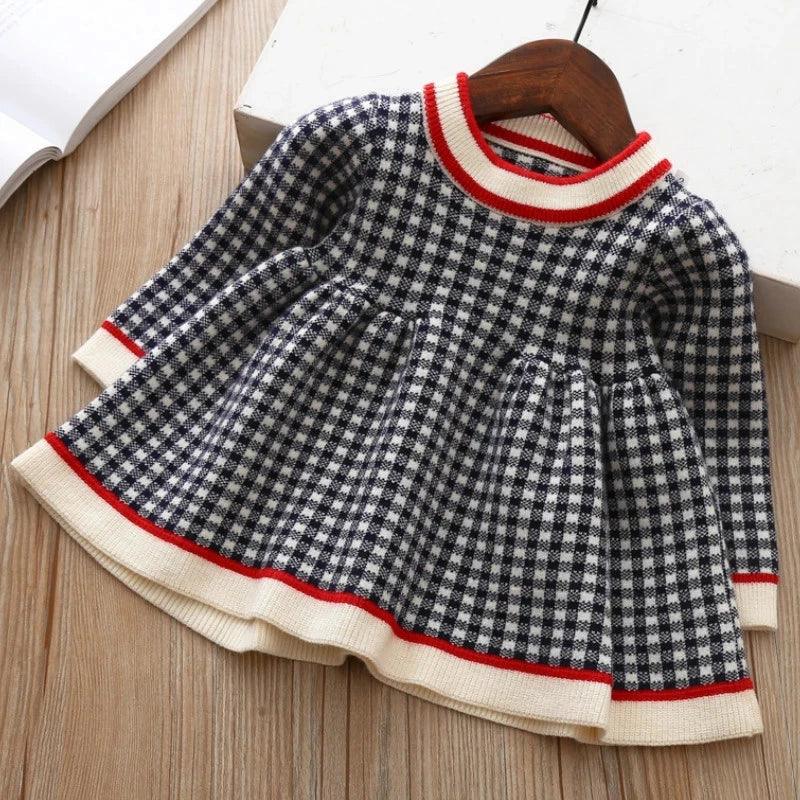 Girls black and white checkered winter knit dress for little girls with red and cream trim long sleeve