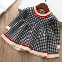 Girls black and white checkered winter knit dress for little girls with red and cream trim long sleeve