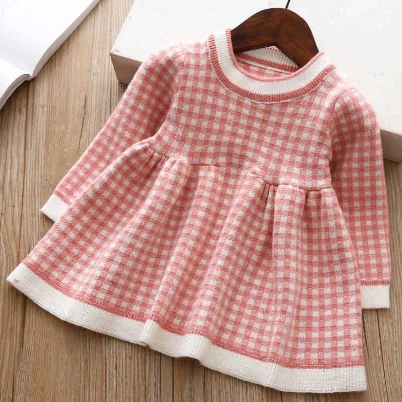 Pink and white checkered winter knit dress for little girls with long sleeves and ribbed collar