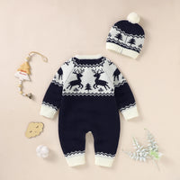 Navy and white winter knit rompers for babies with reindeer pattern and matching pom pom hat