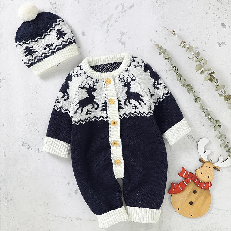 navy and white winter knit rompers for babies with reindeer pattern and matching pompom hat