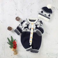 Navy and white winter knit rompers for babies with reindeer pattern and matching pom pom hat