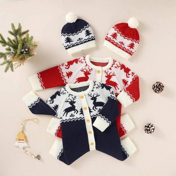 Red and navy winter knit rompers for babies with reindeer pattern and matching pom pom hats