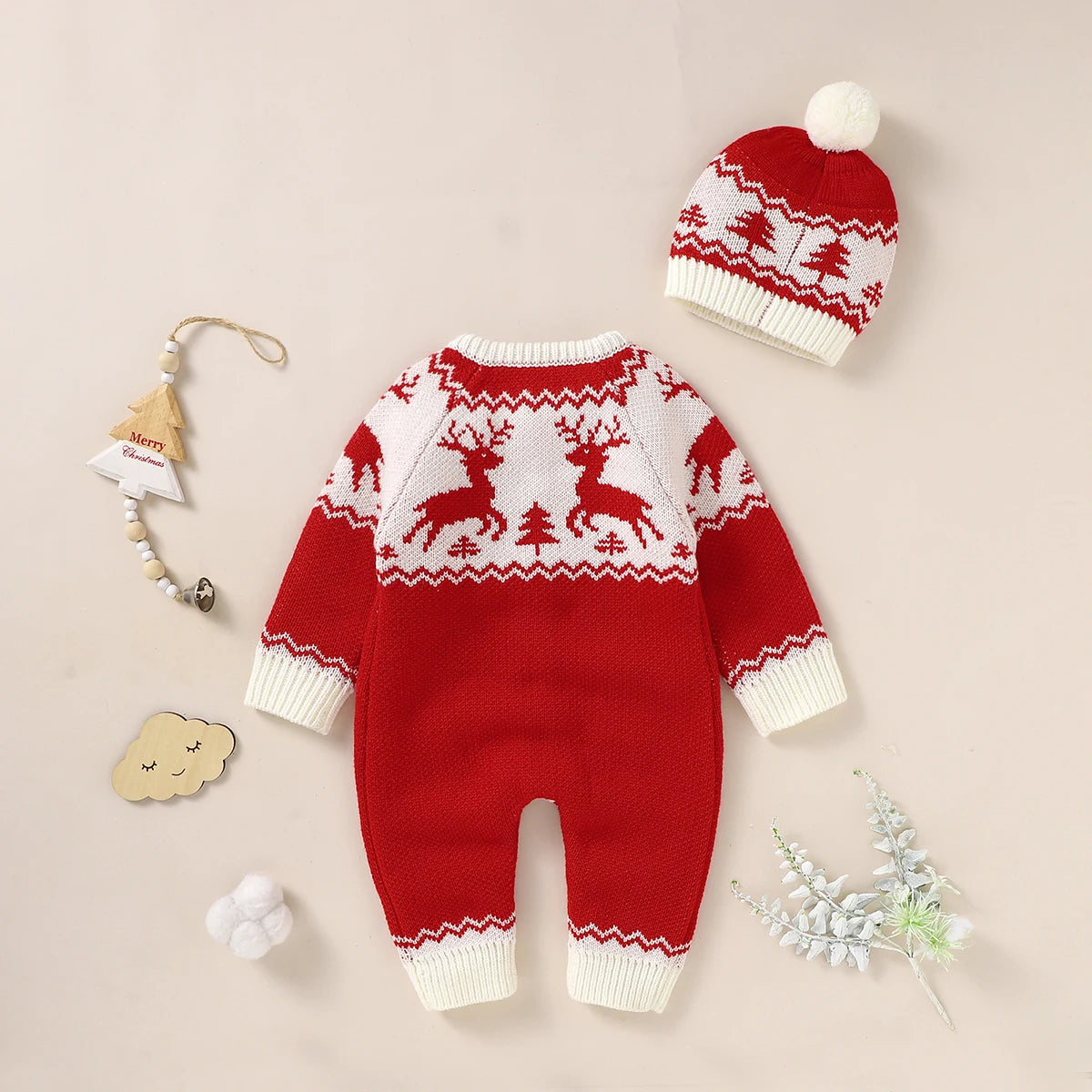 Red and white winter knit rompers for babies with reindeer pattern and matching pom pom hat